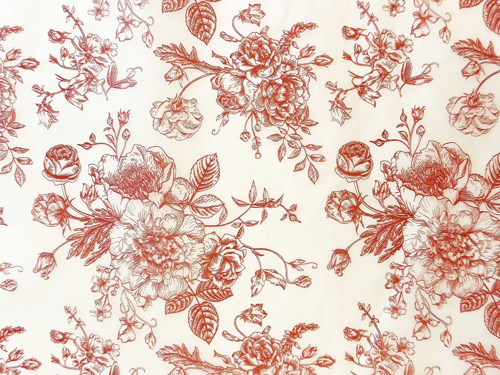 Red floral paper on a beige background